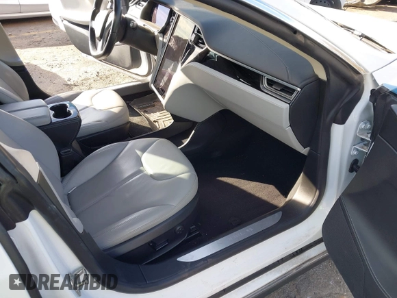 2014 Tesla Model S 60 with VIN 5YJSA1H13EFP62451, listed as a IAAI auction lot 41639068 with 88,000 mi miles and . Bid and sale history available at DreamBid. Image 5.