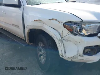 2017 Toyota Tacoma SR5 with VIN 5TFAZ5CN8HX043633, listed as a IAAI auction lot 41520703 with 104,711 mi miles and . Bid and sale history available at DreamBid. Image 6.
