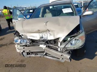 2004 Toyota Camry LE with VIN JTDBF32K140154908, listed as a IAAI auction lot 41773923 with 133,028 mi miles. Bid and sale history available at carsss.com. Image 6.