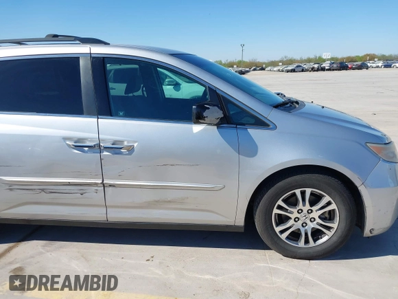2012 Honda Odyssey EX with VIN 5FNRL5H48CB131881, listed as a IAAI auction lot 41822159 with 354,718 mi miles and . Bid and sale history available at DreamBid. Image 6.