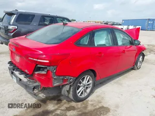 2015 Ford Focus SE z VIN 1FADP3F23FL233620, wystawiony jako IAAI lot #42073204 z przebiegiem 129 109 mil mil oraz . Historia ofert i sprzedaży dostępna na DreamBid. Obrazek 4.