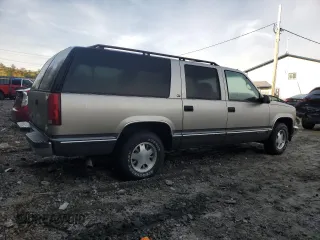 1999 GMC Suburban z VIN 3GKEC16R4XG536985, wystawiony jako Copart lot #73421824 z przebiegiem 181 327 mil mil oraz Tytuł czysty. Historia ofert i sprzedaży dostępna na DreamBid. Obrazek 3.