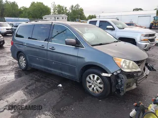 2010 Honda Odyssey EX-L z VIN 5FNRL3H78AB015933, wystawiony jako IAAI lot #42721599 z przebiegiem 124 105 mil mil oraz . Historia ofert i sprzedaży dostępna na DreamBid. Obrazek 1.