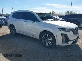 2021 Cadillac XT6 Premium Luxury z VIN 1GYKPCRS6MZ230499, wystawiony jako IAAI lot #41808404 z przebiegiem 86 933 mil mil oraz . Historia ofert i sprzedaży dostępna na DreamBid. Obrazek 1.