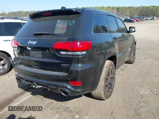 2017 Jeep Grand Cherokee SRT with VIN 1C4RJFDJ2HC696025, listed as a IAAI auction lot 41863274 with 126,949 mi miles. Bid and sale history available at carsss.com. Image 4.