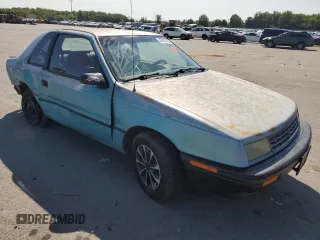 1992 Plymouth Sundance z VIN 1P3XP24D7NN120553, wystawiony jako Copart lot #68472794 z przebiegiem 148 535 mil mil oraz Szkody całkowita. Historia ofert i sprzedaży dostępna na DreamBid. Obrazek 4.