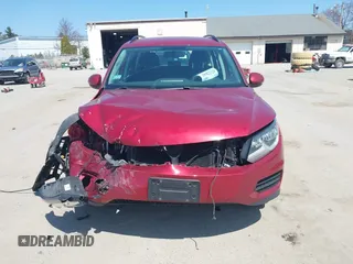 2015 Volkswagen Tiguan SE z VIN WVGBV7AX7FW056002, wystawiony jako IAAI lot #42122641 z przebiegiem 77 037 mil mil oraz . Historia ofert i sprzedaży dostępna na DreamBid. Obrazek 12.