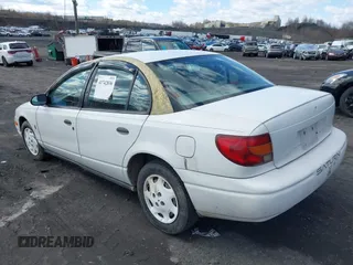 2000 Saturn SL z VIN 1G8ZH5280YZ251280, wystawiony jako IAAI lot #41742836 z przebiegiem 180 249 mil mil oraz . Historia ofert i sprzedaży dostępna na DreamBid. Obrazek 3.