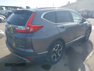 2018 Honda CR-V Touring with VIN 7FARW1H93JE027294, listed as a IAAI auction lot 41903484 with 80,999 mi miles and . Bid and sale history available at DreamBid. Image 4.