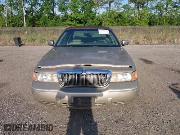 1999 Mercury Grand Marquis LS z VIN 2MEFM75W1XX703878, wystawiony jako IAAI lot #42074187 z przebiegiem 56 962 mil mil oraz . Historia ofert i sprzedaży dostępna na DreamBid. Obrazek 6.