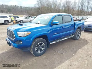 2018 Toyota Tacoma SR with VIN 3TMCZ5AN3JM136826, listed as a IAAI auction lot 41664482 with 124,731 mi miles. Bid and sale history available at carsss.com. Image 2.