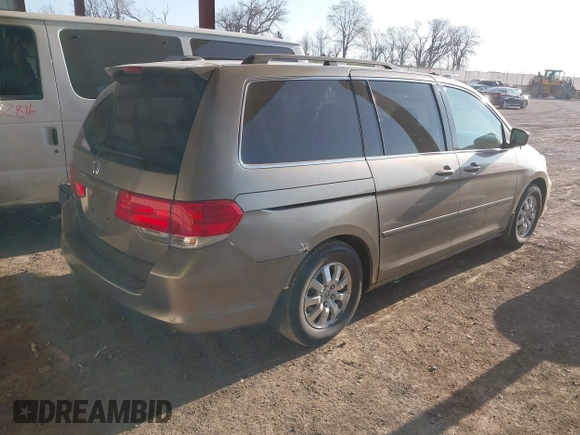 2010 Honda Odyssey EX-L with VIN 5FNRL3H79AB048049, listed as a IAAI auction lot 42055090 with 142,736 mi miles. Bid and sale history available at carsss.com. Image 4.