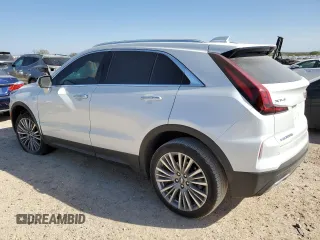 2024 Cadillac XT4 FWD Premium Luxury z VIN 1GYFZCR44RF239840, wystawiony jako Copart lot #48870445 z przebiegiem 5 276 mil mil oraz Szkoda całkowita • Salvage title. Historia ofert i sprzedaży dostępna na DreamBid. Obrazek 2.
