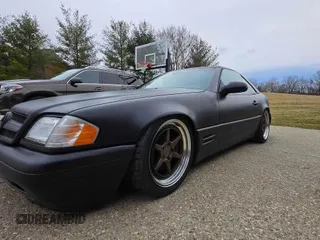 1999 Mercedes-Benz SL-Class with VIN WDBFA68FXXF184548, listed as a Copart auction lot 48104955 with 133,450 mi miles and Clean Title. Bid and sale history available at carsss.com. Image 2.