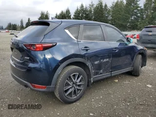 2018 Mazda CX-5 Touring with VIN JM3KFACM8J1349356, listed as a Copart auction lot 89154055 with 82,719 mi miles and Salvage Title. Bid and sale history available at carsss.com. Image 3.