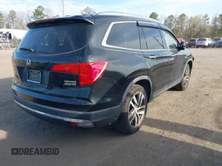 2017 Honda Pilot Touring with VIN 5FNYF6H9XHB062171, listed as a IAAI auction lot 41927969 with 210,633 mi miles. Bid and sale history available at carsss.com. Image 4.