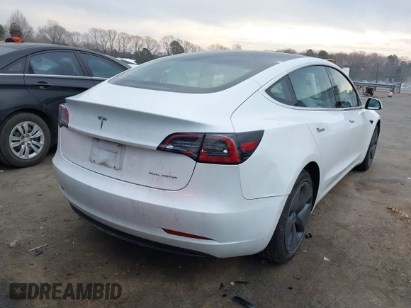 2018 Tesla Model 3 Long Range Battery with VIN 5YJ3E1EB4JF086012, listed as a IAAI auction lot 41683859 with 52,059 mi miles and . Bid and sale history available at DreamBid. Image 16.