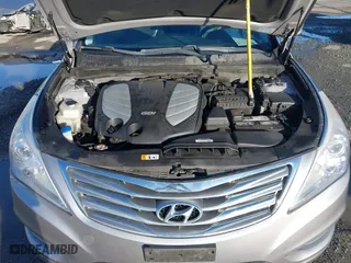 2013 Hyundai Azera with VIN KMHFH4JG3DA230844, listed as a IAAI auction lot 41817997 with 129,163 mi miles. Bid and sale history available at carsss.com. Image 10.