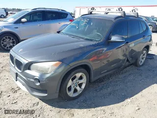 2014 BMW X1 sDrive28i with VIN WBAVM1C57EVW52502, listed as a IAAI auction lot 41702746 with 165,089 mi miles. Bid and sale history available at carsss.com. Image 2.