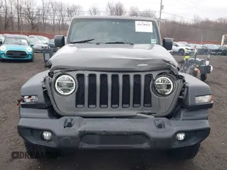 2021 Jeep Wrangler Unlimited Sport S with VIN 1C4HJXDG5MW614688, listed as a IAAI auction lot 41678964 with 89,309 mi miles. Bid and sale history available at carsss.com. Image 19.