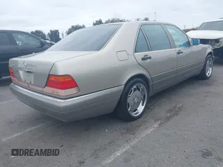 1996 Mercedes-Benz S with VIN WDBGA57E8TA318326, listed as a IAAI auction lot 42072979 with 97,504 mi miles and . Bid and sale history available at DreamBid. Image 4.