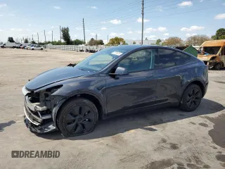 2025 Tesla Model Y Long Range with VIN 7SAYGDED8SF241779, listed as a Copart auction lot 51899205 with 12,409 mi miles and Salvage Title. Bid and sale history available at DreamBid. Image 1.