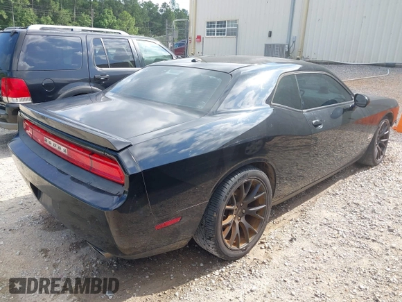 2014 Dodge Challenger R/T Plus z VIN 2C3CDYBT1EH201887, wystawiony jako IAAI lot #42225211 z przebiegiem 278 574 mil mil oraz . Historia ofert i sprzedaży dostępna na DreamBid. Obrazek 4.