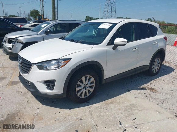 2016 Mazda CX-5 Touring with VIN JM3KE4CY1G0914990, listed as a IAAI auction lot 42030264 with 147,578 mi miles. Bid and sale history available at carsss.com. Image 17.