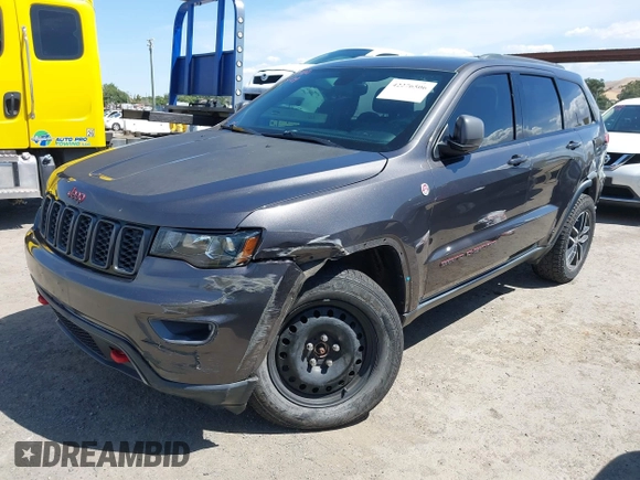 2017 Jeep Grand Cherokee Trailhawk with VIN 1C4RJFLG3HC877110, listed as a IAAI auction lot 42276506 with 144,993 mi miles and . Bid and sale history available at DreamBid. Image 2.