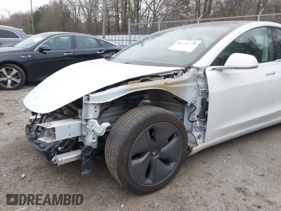 2020 Tesla Model 3 Standard Range Plus with VIN 5YJ3E1EA1LF799766, listed as a IAAI auction lot 41386508 with 90,000 mi miles. Bid and sale history available at carsss.com. Image 20.