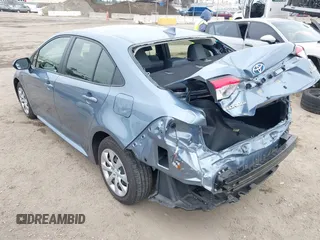 2023 Toyota Corolla Hybrid LE with VIN JTDBCMFE8PJ013271, listed as a IAAI auction lot 42099797 with 14,080 mi miles and . Bid and sale history available at carsss.com. Image 3.