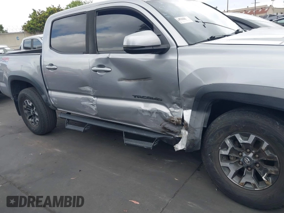 2020 Toyota Tacoma SR5 z VIN 3TMCZ5AN6LM288974, wystawiony jako IAAI lot #42185181 z przebiegiem 94 759 mil mil oraz . Historia ofert i sprzedaży dostępna na DreamBid. Obrazek 13.