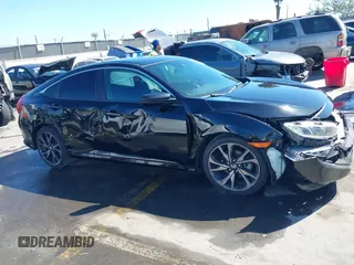 2021 Honda Civic Sport with VIN 2HGFC2F81MH529499, listed as a IAAI auction lot 41836215 with 55,833 mi miles and . Bid and sale history available at DreamBid. Image 13.