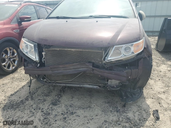 2014 Honda Odyssey Touring with VIN 5FNRL5H95EB067703, listed as a Copart auction lot 71066034 with 0 mi miles and Salvage Title. Bid and sale history available at carsss.com. Image 9.