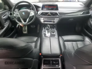 2019 BMW 7 Series 750i with VIN WBA7F0C54KGM25281, listed as a Copart auction lot 84741334 with 76,472 mi miles and Salvage Title. Bid and sale history available at carsss.com. Image 8.
