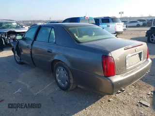 2002 Cadillac DeVille DHS z VIN 1G6KE57Y52U283531, wystawiony jako IAAI lot #41640930 z przebiegiem 94 435 mil mil oraz . Historia ofert i sprzedaży dostępna na DreamBid. Obrazek 3.