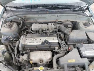 2003 Hyundai Accent GL with VIN KMHCG35C23U264360, listed as a IAAI auction lot 42033316 with 100,991 mi miles. Bid and sale history available at carsss.com. Image 10.