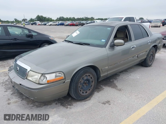2003 Mercury Grand Marquis GS Convenience z VIN 2MEFM74W83X678151, wystawiony jako IAAI lot #42393410 z przebiegiem 273 966 mil mil oraz . Historia ofert i sprzedaży dostępna na DreamBid. Obrazek 2.