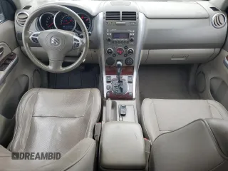 2009 Suzuki Grand Vitara z VIN JS3TE149794100133, wystawiony jako Copart lot #52919795 z przebiegiem 207 928 mil mil oraz Szkoda całkowita • Salvage title. Historia ofert i sprzedaży dostępna na DreamBid. Obrazek 8.