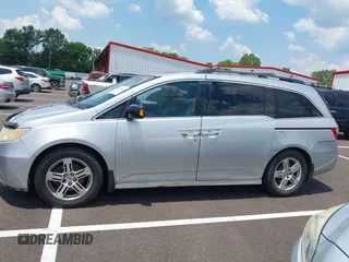 2011 Honda Odyssey Touring with VIN 5FNRL5H99BB058448, listed as a IAAI auction lot 42651432 with 208,581 mi miles and . Bid and sale history available at DreamBid. Image 14.