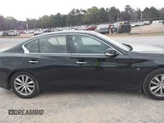 2015 Infiniti Q50 Premium z VIN JN1BV7ARXFM410177, wystawiony jako IAAI lot #41936999 z przebiegiem 129 123 mil mil oraz . Historia ofert i sprzedaży dostępna na DreamBid. Obrazek 13.