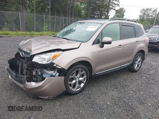 2015 Subaru Forester Touring with VIN JF2SJAUC1FH457069, listed as a IAAI auction lot 42293542 with 71,689 mi miles and . Bid and sale history available at DreamBid. Image 2.