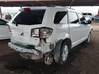 2017 Dodge Journey SXT z VIN 3C4PDDBG2HT595307, wystawiony jako IAAI lot #41813975 z przebiegiem 192 659 mil mil oraz . Historia ofert i sprzedaży dostępna na DreamBid. Obrazek 4.