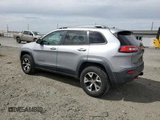 2014 Jeep Cherokee Trailhawk with VIN 1C4PJMBS6EW159174, listed as a Copart auction lot 56097795 with 130,299 mi miles and Salvage title. Bid and sale history available at DreamBid. Image 2.