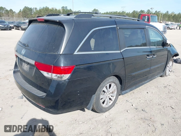2015 Honda Odyssey EX-L with VIN 5FNRL5H65FB088106, listed as a IAAI auction lot 41880915 with 176,539 mi miles and . Bid and sale history available at carsss.com. Image 4.