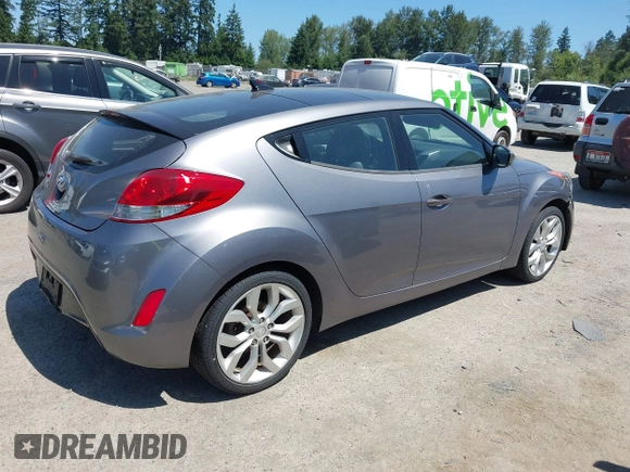 2012 Hyundai Veloster w/Black Int with VIN KMHTC6AD5CU030788, listed as a IAAI auction lot 42774337 with 104,297 mi miles and . Bid and sale history available at DreamBid. Image 4.