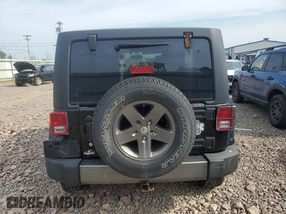 2015 Jeep Wrangler Unlimited Freedom with VIN 1C4BJWDG4FL568601, listed as a Copart auction lot 64041415 with 128,874 mi miles and Salvage title. Bid and sale history available at DreamBid. Image 6.