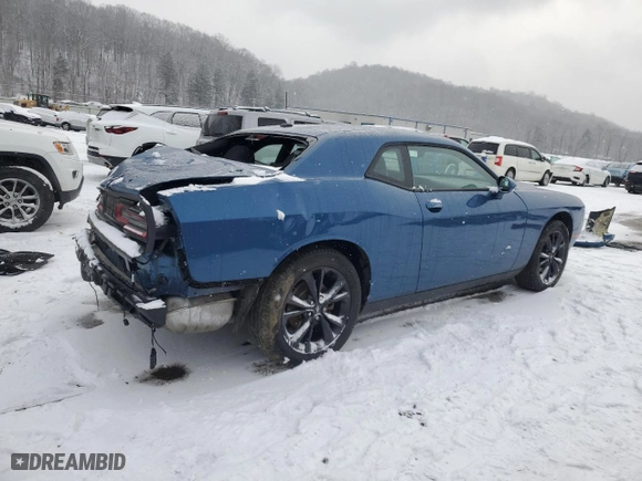 2021 Dodge Challenger SXT with VIN 2C3CDZGG2MH605295, listed as a Copart auction lot 87288444 with 22,062 mi miles and Salvage Title. Bid and sale history available at carsss.com. Image 3.