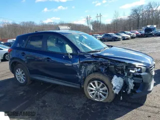 2016 Mazda CX-5 Touring with VIN JM3KE4CY6G0717393, listed as a IAAI auction lot 41596084 with 150,774 mi miles. Bid and sale history available at carsss.com. Image 13.