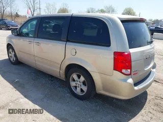2013 Dodge Grand Caravan SE with VIN 2C4RDGBG9DR642162, listed as a IAAI auction lot 42113378 with 182,370 mi miles and . Bid and sale history available at DreamBid. Image 3.